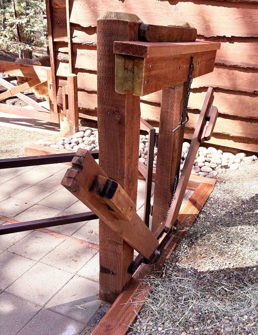 Fence panels attached to stable post side view